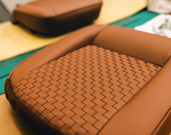  A close up of a leather seat.